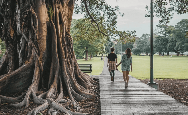 two girls walking in the park