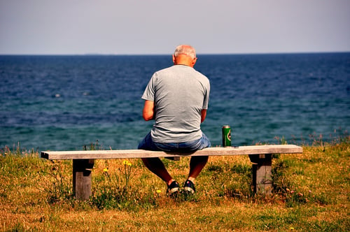 man sitting near the beach