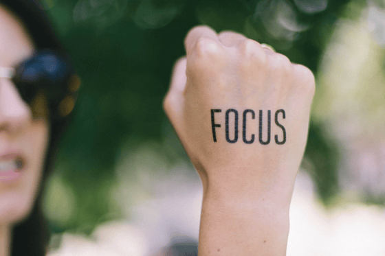 focus written on a hand