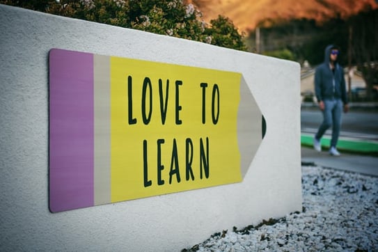 sign with the word "Love to learn"